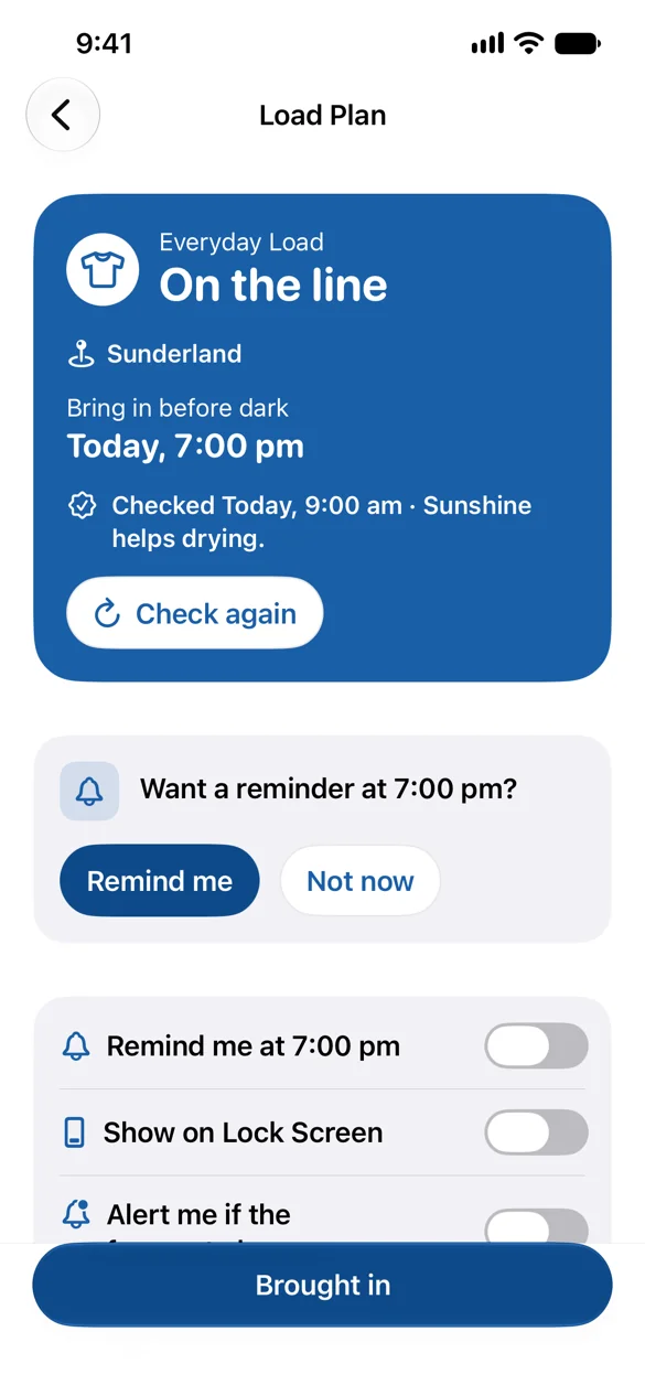 The Load Plan screen, with a blue card on a white screen. An Everyday Load is on the line in Sunderland. Bring in before dark, today, 7:00 pm. Checked today, 9:00 am. Sunshine helps drying. The card has a Check again button. Below it, PegCast asks once: Want a reminder at 7:00 pm? with Remind me and Not now buttons. Below that are the Remind me at 7:00 pm, Show on Lock Screen and Alert me if the forecast changes switches, all off, and a full-width Brought in button.